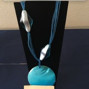 blue disk necklace gently cared for